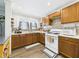 Cozy kitchen with wood cabinets, modern appliances, and bright natural light at 2314 Walnut St, Anderson, IN 46016