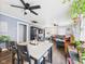 Inviting living space featuring ceiling fans, hardwood floors, and lots of natural light at 2314 Walnut St, Anderson, IN 46016
