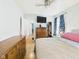 Comfortable bedroom with hardwood floors, closet space, and lots of natural light at 2314 Walnut St, Anderson, IN 46016