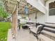 Cozy covered patio featuring comfortable seating, decorative lighting, and a tranquil outdoor space at 2314 Walnut St, Anderson, IN 46016