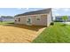 This home has a sliding glass door leading to the spacious backyard with newly installed grass and landscaping at 2334 Black Rock Cir, Lebanon, IN 46052