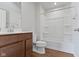 Well-lit bathroom featuring a vanity and a white tub with shower at 2334 Black Rock Cir, Lebanon, IN 46052