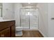 Bathroom featuring walk-in shower with glass doors and vanity with modern fixtures at 2334 Black Rock Cir, Lebanon, IN 46052