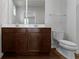 Bathroom showcasing double vanity, a large mirror, and wood-look flooring at 2334 Black Rock Cir, Lebanon, IN 46052