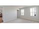 Neutral bedroom featuring new carpet, two windows and an ensuite bathroom at 2334 Black Rock Cir, Lebanon, IN 46052