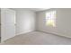 Clean and simple bedroom with neutral walls, carpet, and a bright window at 2334 Black Rock Cir, Lebanon, IN 46052