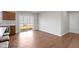 Bright dining area with wood floors, sliding glass door, and stainless steel dishwasher at 2334 Black Rock Cir, Lebanon, IN 46052
