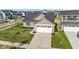Charming home with a well-manicured lawn, beautiful landscaping, an attached two-car garage and a spacious driveway at 2334 Black Rock Cir, Lebanon, IN 46052