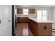 Modern kitchen with stainless steel appliances, an island with seating, and ample counter space at 2334 Black Rock Cir, Lebanon, IN 46052