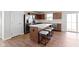 Chic kitchen island with breakfast bar, modern stainless appliances, and access to the backyard at 2334 Black Rock Cir, Lebanon, IN 46052