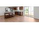 Modern kitchen featuring a breakfast bar, stainless steel appliances, and sliding glass doors to backyard at 2334 Black Rock Cir, Lebanon, IN 46052