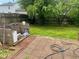 Fenced backyard featuring brick patio area and a grill made of cinder blocks at 2350 Harvest Moon Dr, Greenwood, IN 46143
