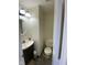 Efficient half bathroom with a pedestal sink, mirror, and toilet at 2350 Harvest Moon Dr, Greenwood, IN 46143