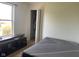 Bedroom featuring a window, an open closet, and a bed with a patterned mattress on the floor at 2350 Harvest Moon Dr, Greenwood, IN 46143