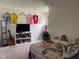 A cozy bedroom is furnished with a television, a bed and a guitar at 2350 Harvest Moon Dr, Greenwood, IN 46143