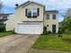 Charming two-story home featuring a two-car garage, lovely front yard, and welcoming curb appeal at 2350 Harvest Moon Dr, Greenwood, IN 46143