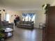 Comfortable living room featuring wood floors, neutral decor, and a beautiful couch set at 2350 Harvest Moon Dr, Greenwood, IN 46143