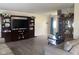 Cozy living room with hardwood floors, a lovely china cabinet and entertainment center at 2350 Harvest Moon Dr, Greenwood, IN 46143