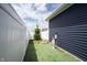 Enclosed backyard featuring a patch of low maintenance turf and privacy fence at 2628 Lamar Dr, Whitestown, IN 46075