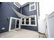 Blue house featuring sliding glass door, patio, and shade at 2628 Lamar Dr, Whitestown, IN 46075