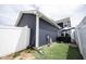 Side yard featuring a hot tub and green space, enclosed by a white privacy fence at 2628 Lamar Dr, Whitestown, IN 46075