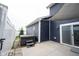 This backyard features a hot tub, concrete patio, and shade for relaxing and entertaining at 2628 Lamar Dr, Whitestown, IN 46075