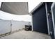 A backyard patio view showcasing the hot tub, privacy fence and overhead shade structure at 2628 Lamar Dr, Whitestown, IN 46075