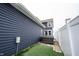 The artificial turf backyard offers a secluded hot tub area, and privacy fence at 2628 Lamar Dr, Whitestown, IN 46075