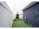 A secluded backyard with a privacy fence and artificial turf provides an intimate outdoor space at 2628 Lamar Dr, Whitestown, IN 46075
