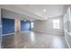 Unfinished basement with gray wood floors, blue accent wall, and recessed lighting at 2628 Lamar Dr, Whitestown, IN 46075