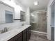 Bright bathroom with double sinks, frameless mirrors, and glass-enclosed tiled shower at 2628 Lamar Dr, Whitestown, IN 46075