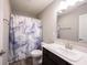 Modern bathroom features a new vanity, brushed nickle faucet and a blue marbled shower curtain at 2628 Lamar Dr, Whitestown, IN 46075