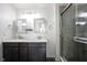 Bathroom featuring a granite vanity with double sinks, stainless steel fixtures, large mirrors and tile shower at 2628 Lamar Dr, Whitestown, IN 46075