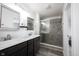 Bathroom featuring a granite vanity with double sinks, stainless steel fixtures, a large mirror and glass shower at 2628 Lamar Dr, Whitestown, IN 46075