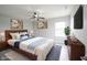 Virtually staged bedroom with modern furnishings, cozy rug, and warm, inviting decor at 2628 Lamar Dr, Whitestown, IN 46075