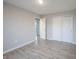 A well lit bedroom with hard wood flooring and closet space at 2628 Lamar Dr, Whitestown, IN 46075