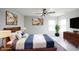Beautifully staged bedroom with stylish furnishings, artwork, and a cozy rug for a warm ambiance at 2628 Lamar Dr, Whitestown, IN 46075