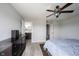 Spacious bedroom featuring light gray walls, wood floors, a decorative ceiling fan and ensuite bathroom at 2628 Lamar Dr, Whitestown, IN 46075