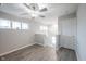 Bright bedroom with a ceiling fan, two windows, and luxury vinyl plank flooring at 2628 Lamar Dr, Whitestown, IN 46075