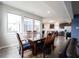 Bright dining area with wood floors, modern lighting and view of updated kitchen with stainless appliances at 2628 Lamar Dr, Whitestown, IN 46075