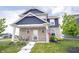 Beautiful two-story home with stone and siding, featuring a welcoming front porch at 2628 Lamar Dr, Whitestown, IN 46075
