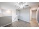 Hallway with gray walls, luxury vinyl plank flooring, and white doors at 2628 Lamar Dr, Whitestown, IN 46075