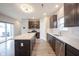 Modern kitchen with stainless appliances and island with quartz countertops at 2628 Lamar Dr, Whitestown, IN 46075