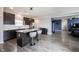 Modern kitchen features gray cabinets, stainless appliances, island seating, and open floor plan at 2628 Lamar Dr, Whitestown, IN 46075