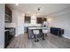 Modern kitchen features gray cabinets, stainless appliances, island seating and white subway tile backsplash at 2628 Lamar Dr, Whitestown, IN 46075