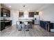 Spacious kitchen featuring stainless appliances, island with seating, and dark cabinetry at 2628 Lamar Dr, Whitestown, IN 46075