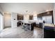 Kitchen with stainless steel appliances, kitchen island with breakfast bar and adjoining living area at 2628 Lamar Dr, Whitestown, IN 46075