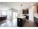 Open kitchen and dining room area with stainless steel appliances and kitchen island at 2628 Lamar Dr, Whitestown, IN 46075