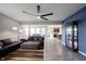 Bright and airy living room showcasing a comfortable seating area, a decorative cabinet, and stylish lighting at 2628 Lamar Dr, Whitestown, IN 46075