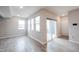 A bright living room with large windows and access to the patio at 2628 Lamar Dr, Whitestown, IN 46075